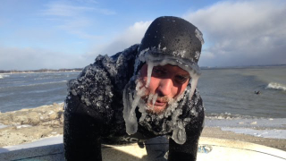 Illustration for article titled These insane people like to surf in ice water